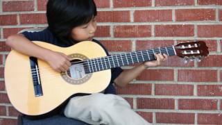 Learn and Boost Your Skills On Guitar In Online Guitar Lessons