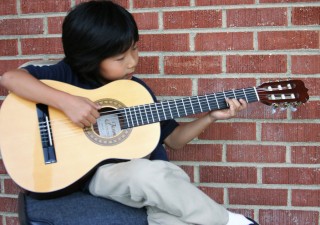 Learn and Boost Your Skills On Guitar In Online Guitar Lessons